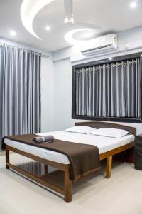 เตียงในห้องที่ Sukhakarta Holiday Home