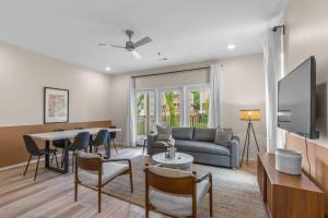 a living room with a couch and a table at Winton Flats by MilaPad in Atlanta