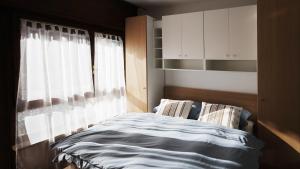 Postelja oz. postelje v sobi nastanitve Mountain Apartment Rododendro