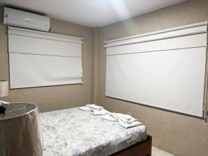 Ένα ή περισσότερα κρεβάτια σε δωμάτιο στο GALASUITES +3 φωτογραφίες