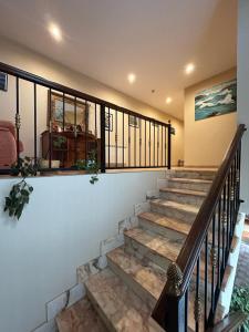 a staircase in a home with a stair railing at Hotel Restaurante el Fornon in Novellana