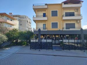 a building with a gate in front of it at ViLa Bakri in Elbasan