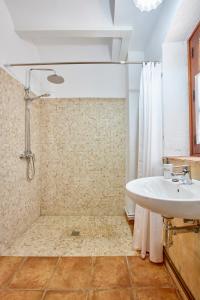 a bathroom with a sink and a shower at Mas Can Calet Aparthotel in Les Franqueses del Vallès