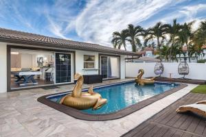 a swimming pool with two rubber ducks in a house at 4 Bedroom Pool Docks Kayak Waterfront view in Fort Lauderdale