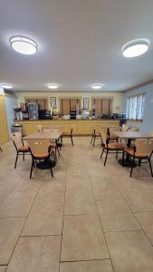 a classroom with tables and chairs in a room at Days Inn by Wyndham Sheridan in Sheridan