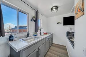 a kitchen with a sink and a window at Canyon's Edge Route 66 Motel in Ash Fork