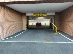 a garage with a car inside of it at Inviting 1-Bed Apartment in the heart of Sheffield in Sheffield