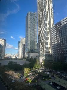 a view of a city with tall buildings at Affordable Staycation Airbnb BGC in Manila