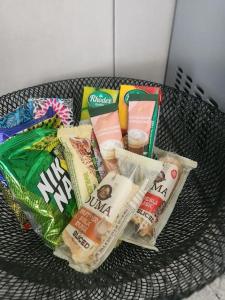 a basket of food and snacks on a table at The Galton Villa in Windhoek