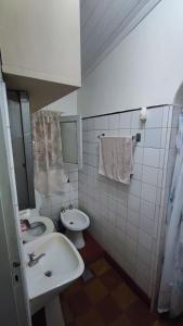 a bathroom with a sink and a toilet at Alojamiento Eldorado in Eldorado