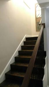 a staircase in a house with a stair case at Sunset Studio with Full Kitchen and no fee in Florence