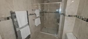 a bathroom with a shower and a sink at Dunderry Lodge Self Catering Family Lodges in Navan +22 photos