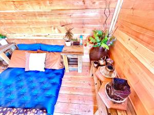 an overhead view of a room with a bed and a table at Beysicair Tents & Campground in California City