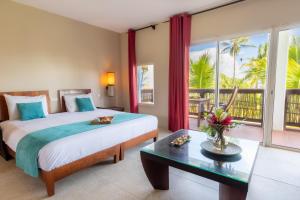 Voodi või voodid majutusasutuse Physacap Suites & Villas toas