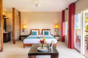 Voodi või voodid majutusasutuse Physacap Suites & Villas toas