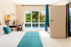 Voodi või voodid majutusasutuse Physacap Suites & Villas toas