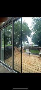 a view of a deck through a sliding glass door at 6 BEDROOM MODERN AND LUXURY HOME in Welland