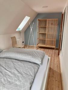 a bedroom with a bed and a wind turbine at Ferienwohnung Weitblick in Bad Schussenried