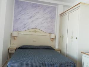 Postel nebo postele na pokoji v ubytování B&B Metropols Sottomarina