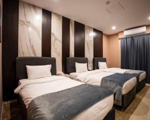Postel nebo postele na pokoji v ubytování Ward Hotel Basra