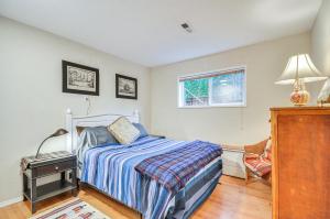 a bedroom with a bed and a window at Cozy Portland Vacation Rental about 6 Mi to Downtown! in Portland