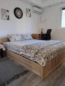 a bed with a wooden frame in a bedroom at Miljakovački konak in Belgrade +17 photos