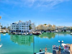 a group of boats are docked in a marina at Pleasant studio with sea view in Benalmádena, 30 m², pool in Benalmádena