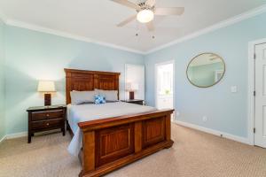 a bedroom with a bed and a ceiling fan at 1005 Crooked Oak Lane in Seabrook Island