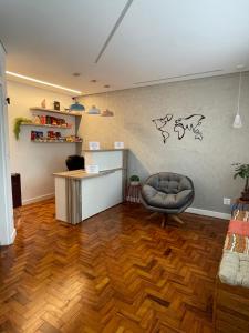 a living room with a desk and a chair at Morada City Hostel in Sao Paulo