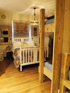 a bedroom with two bunk beds in a room at The Snug in Matlock