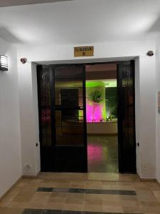 an entrance to a building with a sign on the door at Cosy studio jardin de l’aouina in Tunis