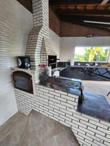 Η κουζίνα ή μικρή κουζίνα στο Casa Sobrado Águas de São Pedro +50 φωτογραφίες