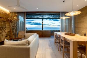 a living room with a couch and a table at 6 Guests - Amazing Views -Top Design in San José del Cabo