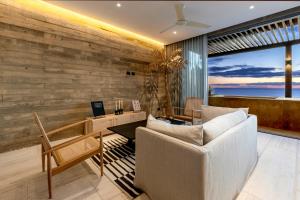 a living room with a couch and a table at 6 Guests - Amazing Views -Top Design in San José del Cabo