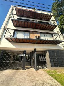 a tall building with gates in front of it at Departamento Güemes in Mar del Plata