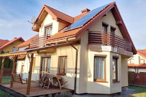 a house with a solar roof and a deck at House between Cracow and Wieliczka in Wieliczka