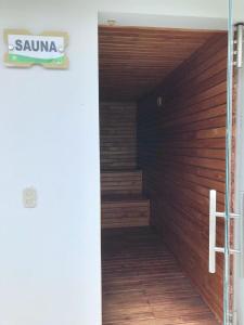 a wooden door with a staircase in a room at casa alvis H7 ,condominio in La Colorada
