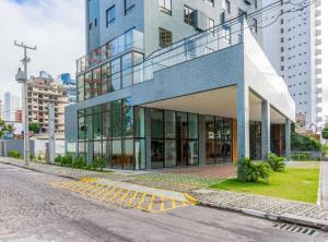 a building on the side of a street at Ilusion hotel flat in Natal