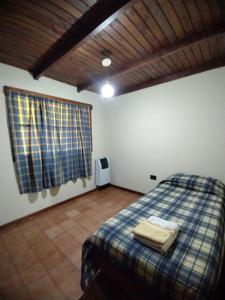 Tempat tidur dalam kamar di Cabañas Lamani