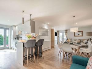 a kitchen and living room with a table and chairs at 2 bed property in Bradford-on-Avon 87056 in Southwick