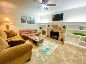 a living room with a couch and a fireplace at Home Sweet Home in Grass Valley in Grass Valley