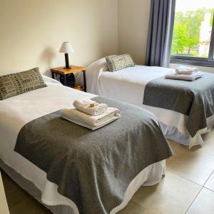 A bed or beds in a room at La Cava Apartments
