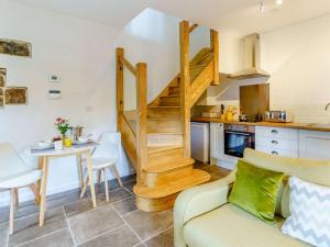a living room with a staircase and a table at 1 bed property in Nantyglo 82705 in Nantyglo