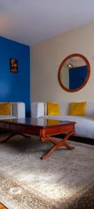 a living room with a coffee table and a couch at Delight homestay shared apartment in Nairobi