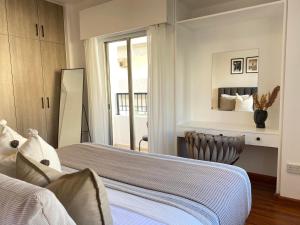 a bedroom with two beds and a window at Central Boutique Twenty One in Nicosia