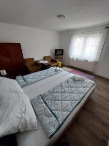 Postel nebo postele na pokoji v ubytování Apartmani Popović