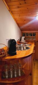 a kitchen with a sink and a toaster on a counter at L'attico di Ovidio in Sulmona +3 photos