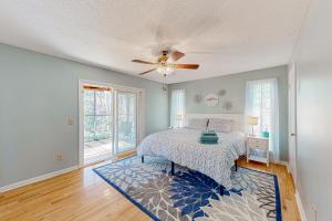 a bedroom with a bed and a ceiling fan at Nantahala in Seneca
