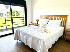 Ένα ή περισσότερα κρεβάτια σε δωμάτιο στο Vila Beach House