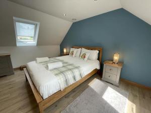 a bedroom with a large bed and a window at Wonderful Property with Parking and a walk into Bakewell in Bakewell